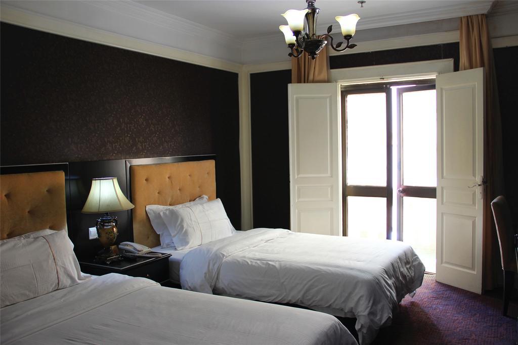 Manhattan Jinling Hotel Shanghái Habitación foto