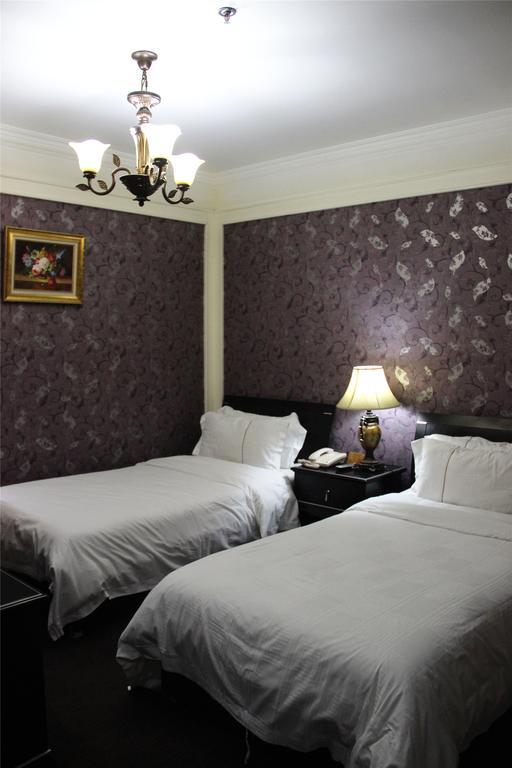 Manhattan Jinling Hotel Shanghái Habitación foto
